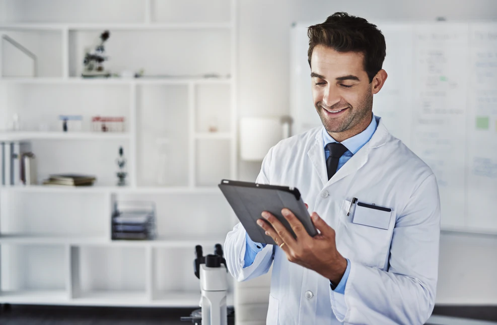 Dr writing on tablet.